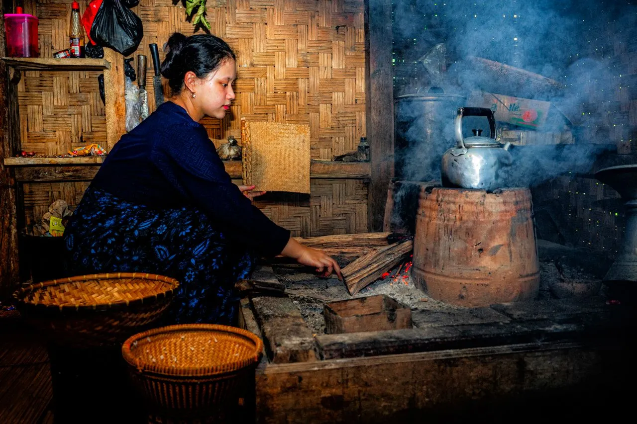 A woman cooking inside an Indonesian house